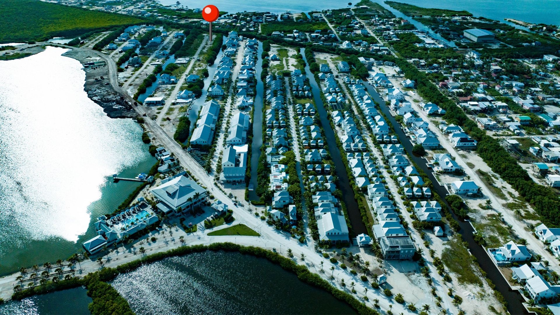 Aerial view of rows of homes lining narrow canals and water